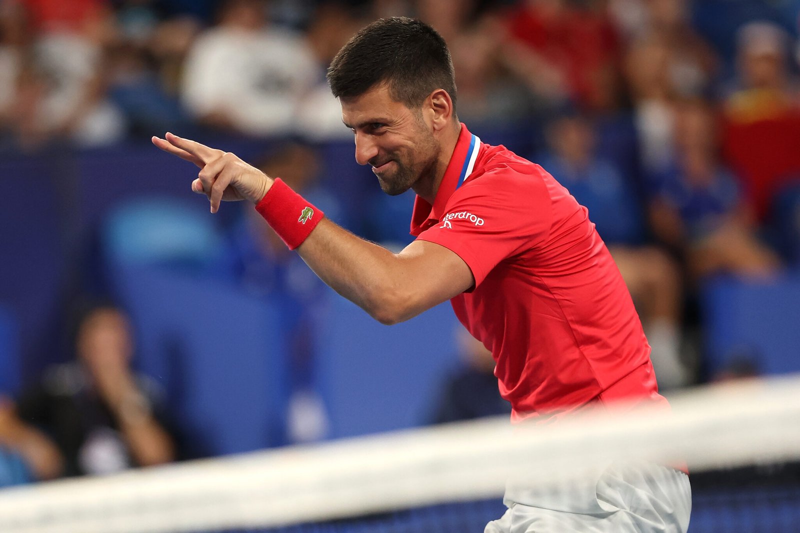 Djokovic le advertía a Zheng.