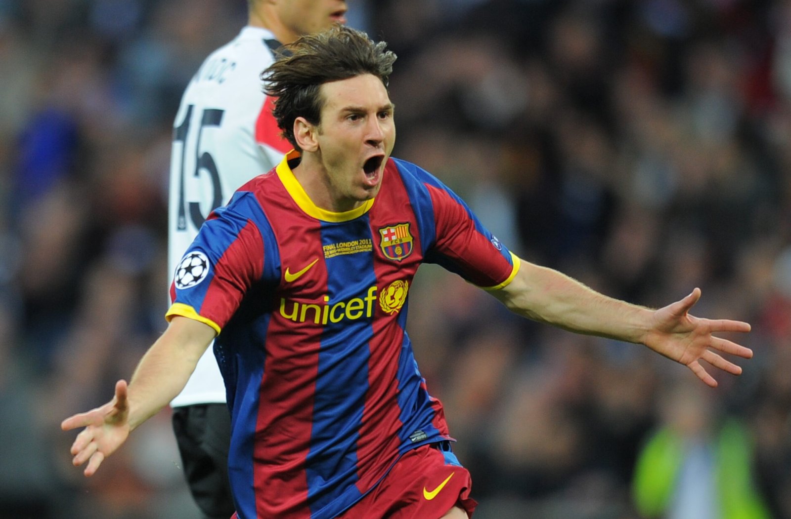 Barcelona's Argentinian forward Lionel Messi celebrates after scoring a goal during the UEFA Champions League final football match FC Barcelona vs. Manchester United, on May 28, 2011 at Wembley stadium in London. AFP PHOTO / LLUIS GENE (Photo credit should read LLUIS GENE/AFP via Getty Images)