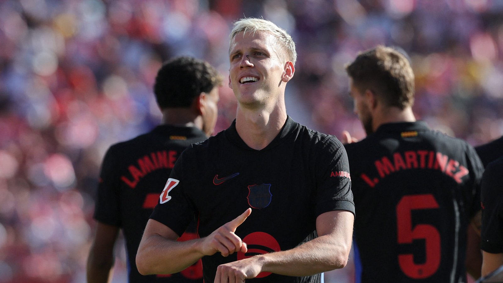 Barcelona's Spanish forward #20 Daniel Olmo celebrates scoring his team's third goal during the Spanish league football match between Girona FC and FC Barcelona at the Montilivi stadium in Girona on September 15, 2024. (Photo by LLUIS GENE / AFP) (Photo by LLUIS GENE/AFP via Getty Images)