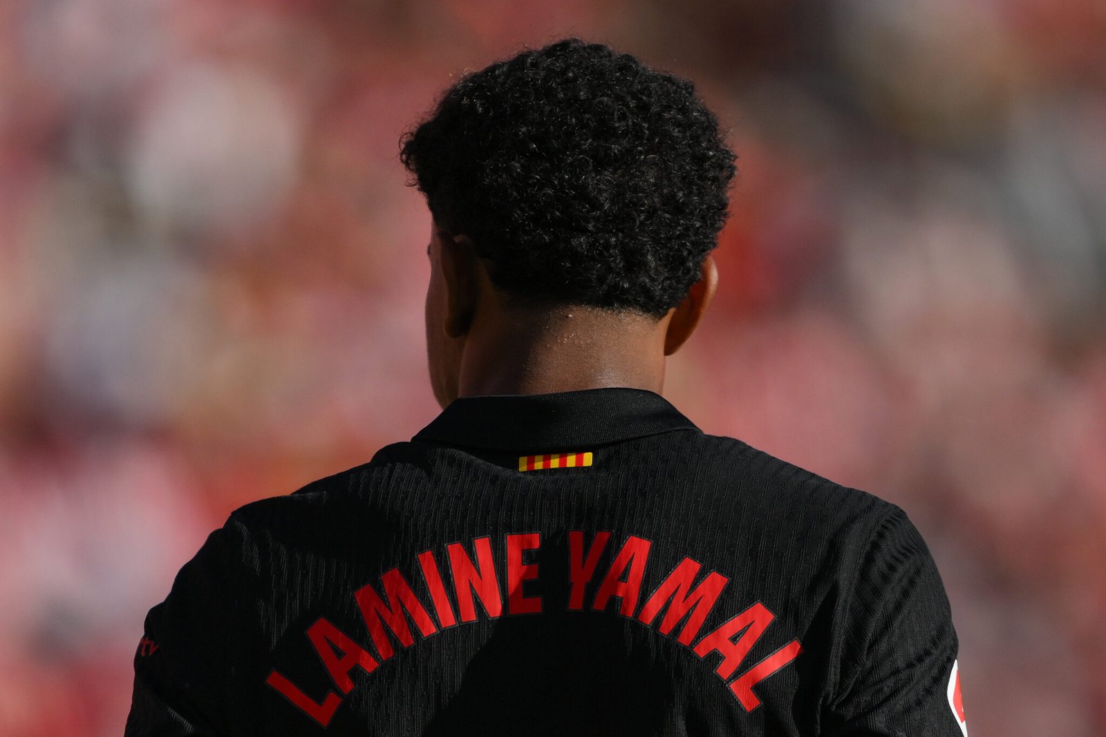 GIRONA, SPAIN - SEPTEMBER 15: Lamine Yamal of Barcelona FC looks on during the LaLiga match between Girona FC and FC Barcelona  at Montilivi Stadium on September 15, 2024 in Girona, Spain. (Photo by David Ramos/Getty Images)