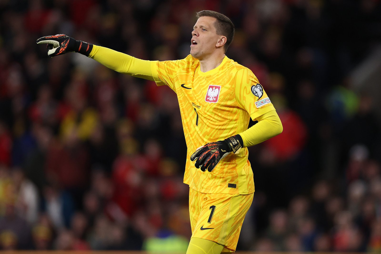 CARDIFF, WALES - MARCH 26: Wojciech Szczesny of Poland challenged by Connor Roberts of Wales during the UEFA EURO 2024 Play-Offs semifinal match between Wales and Poland at Cardiff City Stadium on March 26, 2024 in Cardiff, Wales. (Photo by Michael Steele/Getty Images) (Photo by Michael Steele/Getty Images)