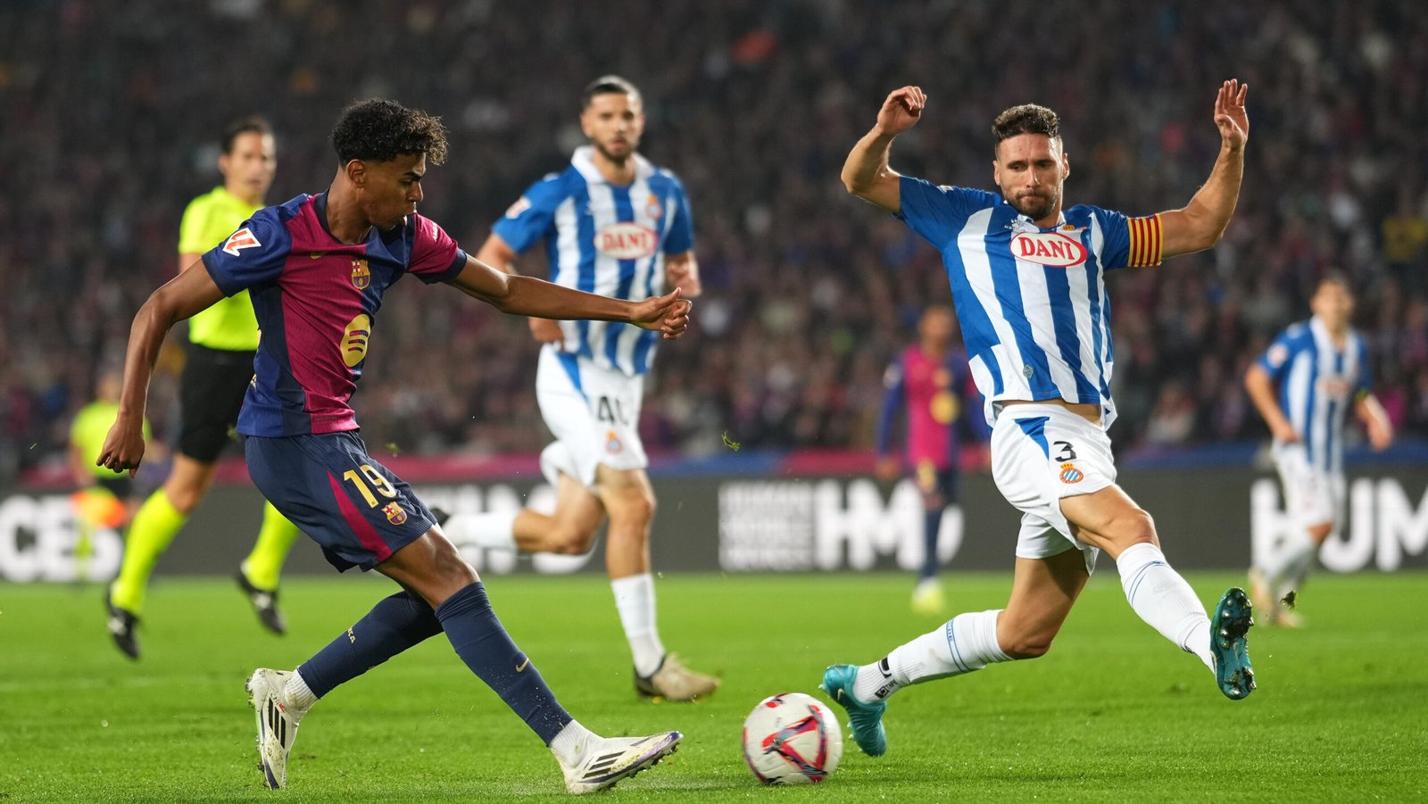 BARCELONA, SPAIN - NOVEMBER 03: Lamine Yamal of FC Barcelona shoots whilst under pressure from Sergi Gomez of RCD Espanyol during the La Liga EA Sports match between FC Barcelona and RCD Espanyol at Estadi Olimpic Lluis Companys on November 03, 2024 in Barcelona, Spain. (Photo by Alex Caparros/Getty Images)