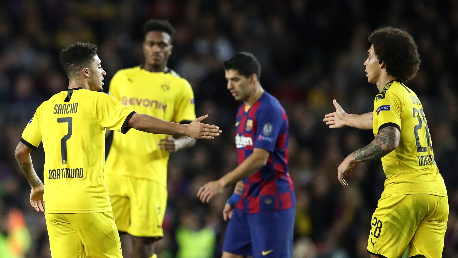 BARCELONA, SPAIN - NOVEMBER 27: Jadon Malik Sancho of Dortmund celebrates with Axel Witsel after scoring his team's first goal during the UEFA Champions League group F match between FC Barcelona and Borussia Dortmund at Camp Nou on November 27, 2019 in Barcelona, Spain. (Photo by Maja Hitij/Bongarts/Getty Images)