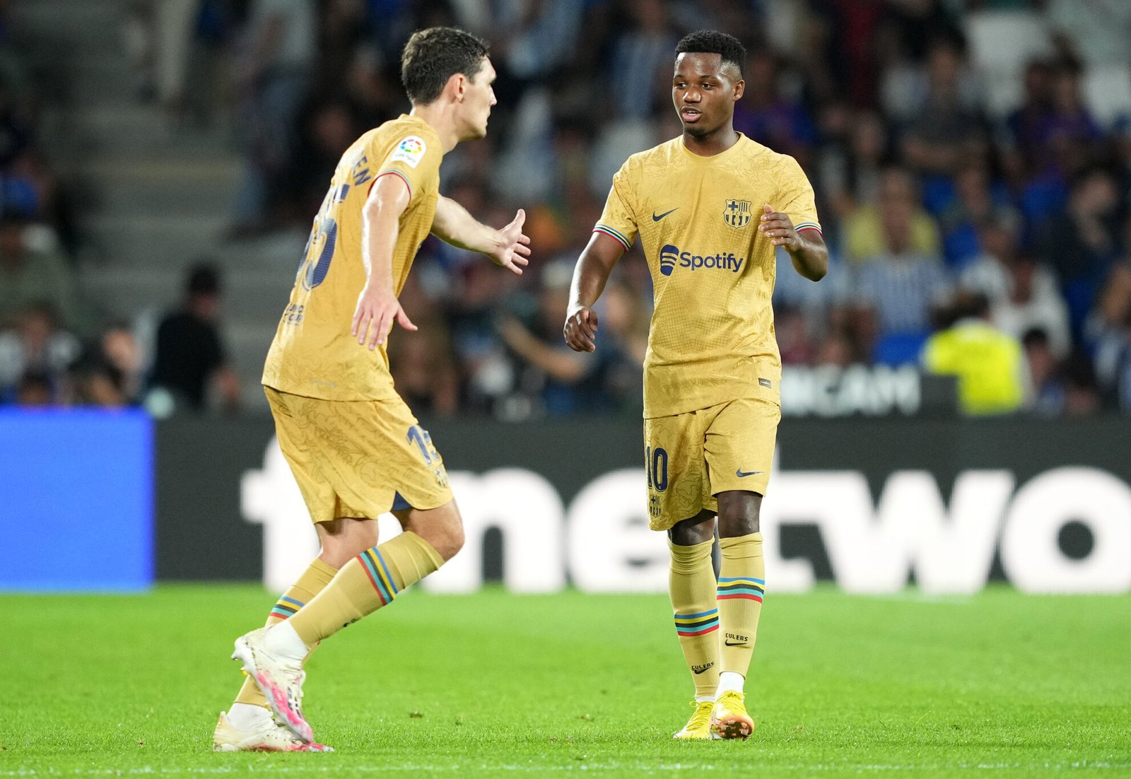 SAN SEBASTIAN, SPAIN - AUGUST 21: Ansu Fati of FC Barcelona celebrates after scoring their side's fourth goal with Andreas Christensen during the LaLiga Santander match between Real Sociedad and FC Barcelona at Reale Arena on August 21, 2022 in San Sebastian, Spain. (Photo by Juan Manuel Serrano Arce/Getty Images)