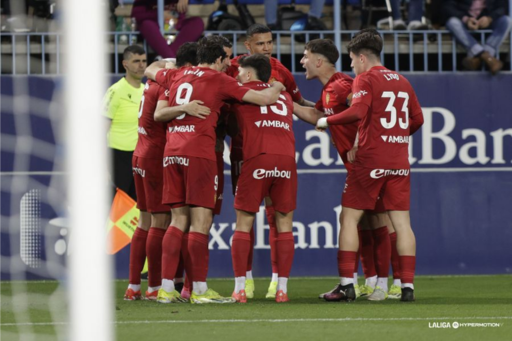 El equipo del Real Zaragoza celebrando el gol de Tasende ante el Málaga CF